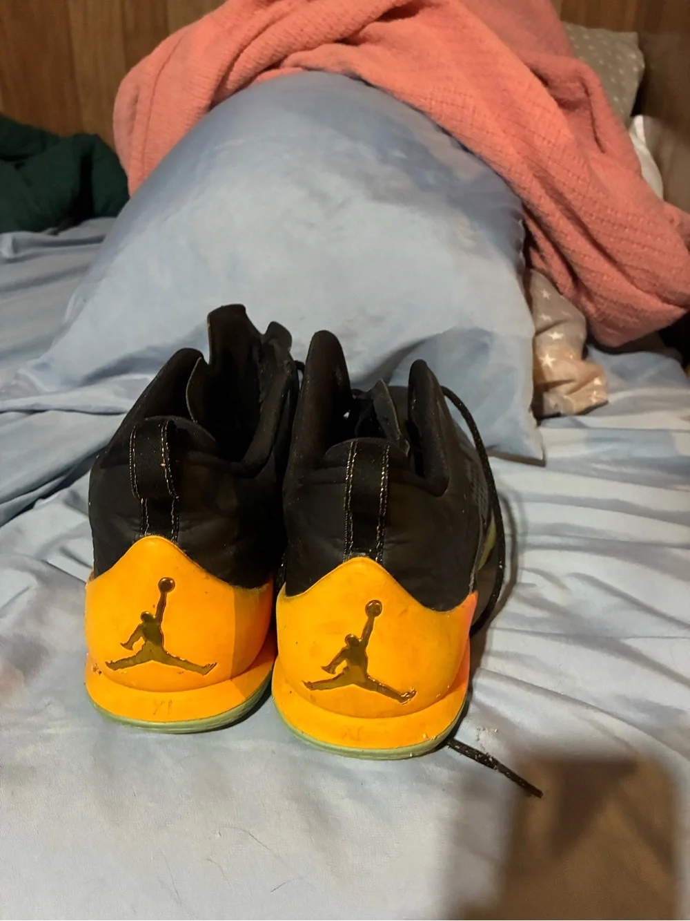 Black Basketball Jordans with Orange Heel Accent